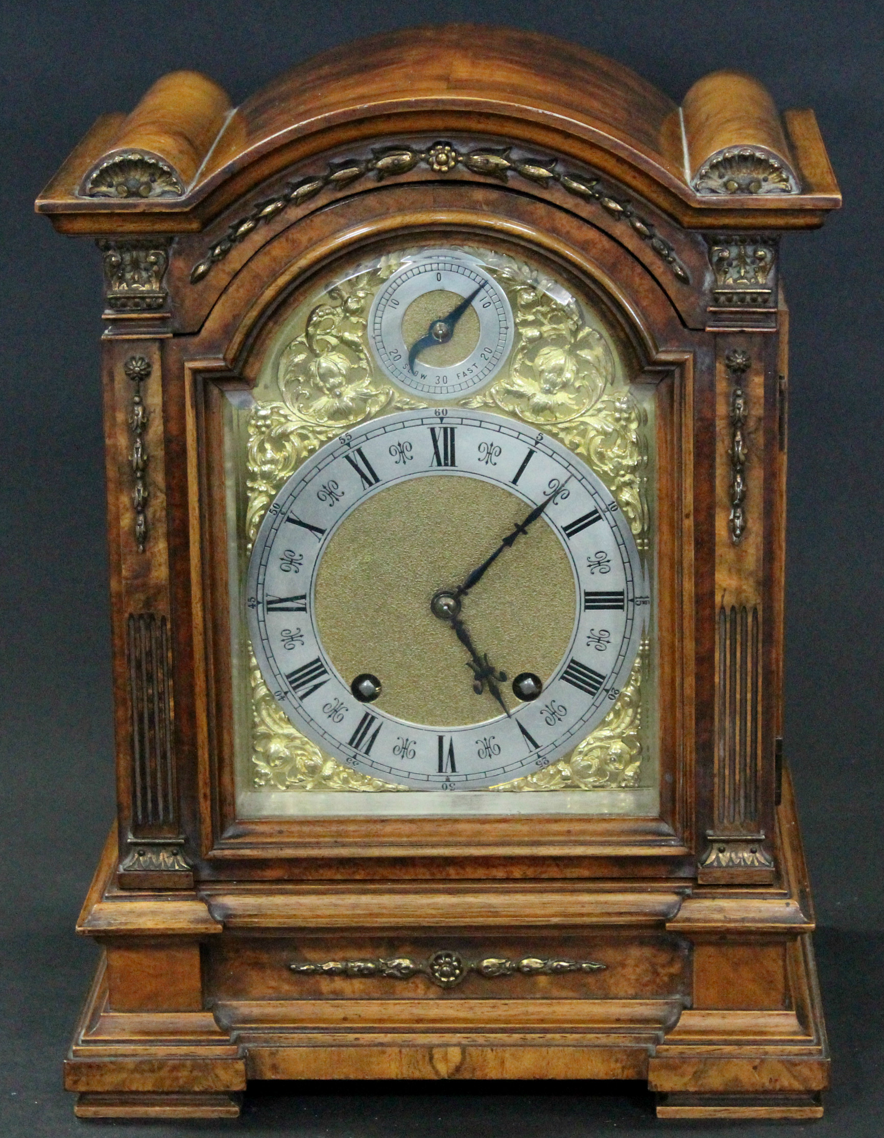 A late 19th century burr-walnut mantel clock in domed-top architectural case with gilt-metal mounts,