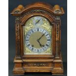 A late 19th century burr-walnut mantel clock in domed-top architectural case with gilt-metal mounts,