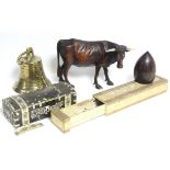 A Black Forest-type carved wood standing model of an ox, 6¾” high (one hoof damaged); an Islamic