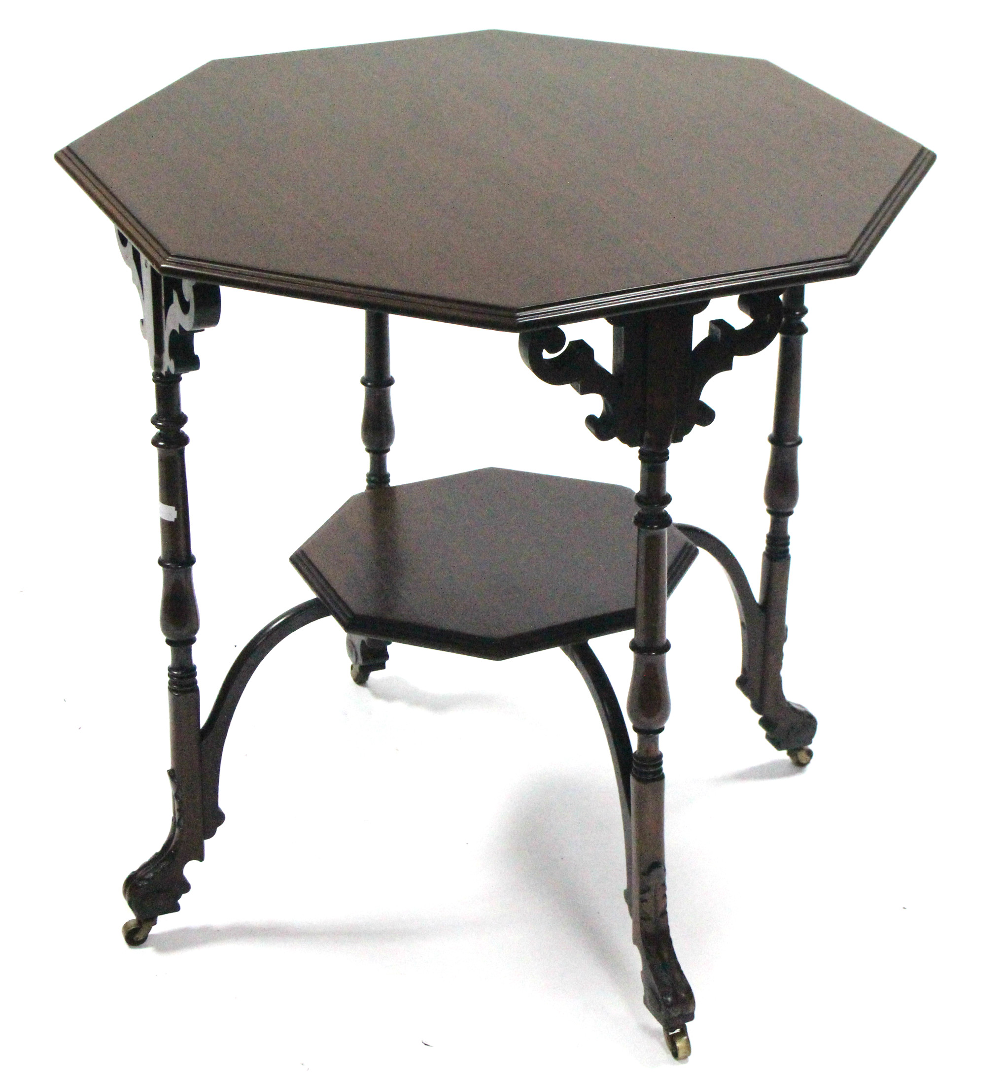 A late Victorian mahogany octagonal occasional table on turned legs with carved stretchers,