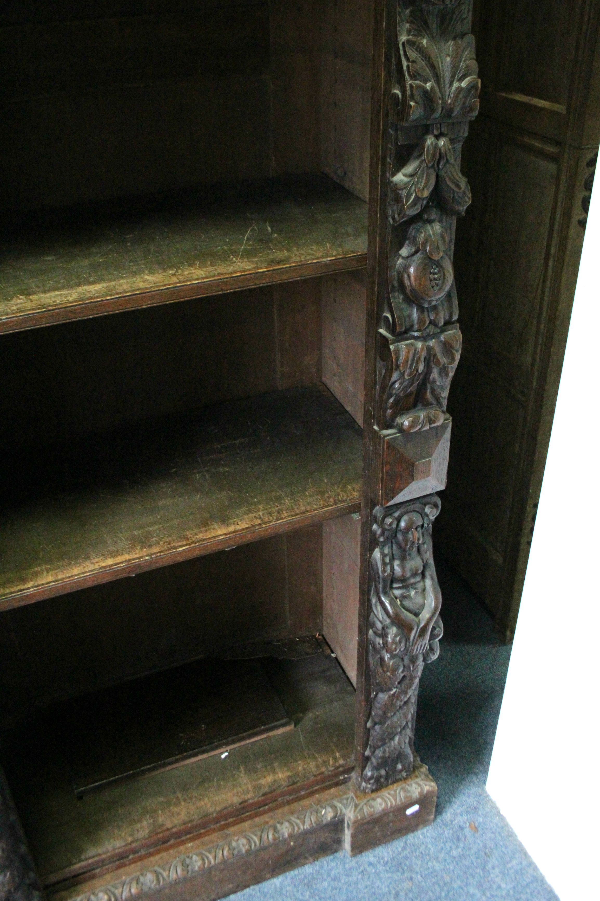 A Victorian oak tall standing open bookcase fitted fourteen adjustable shelves, and heavily carved - Image 5 of 7