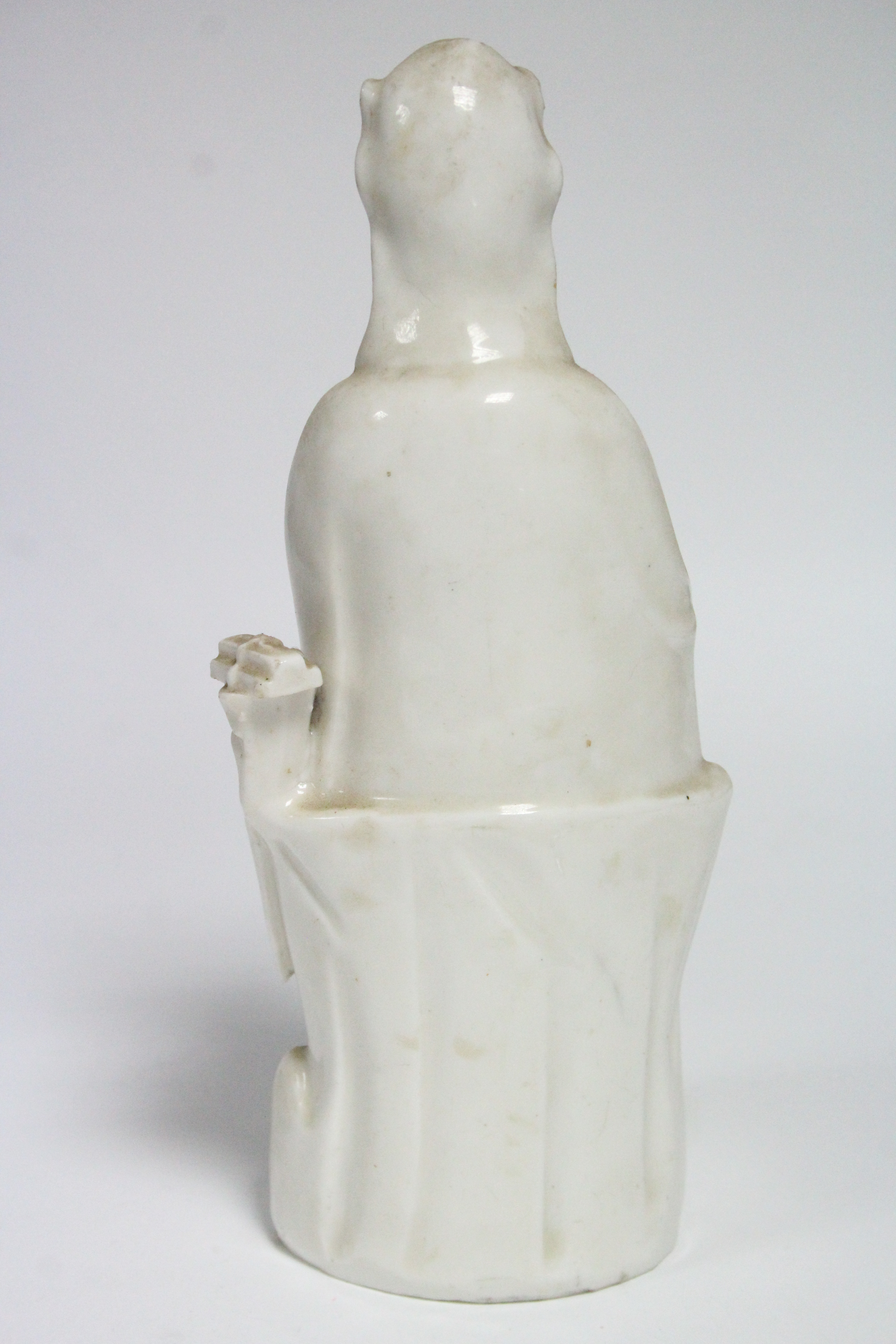 An 18th century Chinese blanc-de-chine figure of Guanyin, seated, with an infant on her lap; 10” - Image 3 of 4