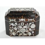 A tortoiseshell & mother-of-pearl inlaid tea caddy with floral decoration to the front & shaped