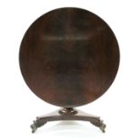 A GEORGE IV FIGURED MAHOGANY LOO TABLE, the circular tilt-top on turned & reeded centre column &