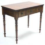 A late Georgian mahogany side table, the rectangular top with reeded edge, fitted three frieze