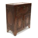 A mid-20th century Chinese camphor-wood chest with all-over carved decoration of mythical beasts,