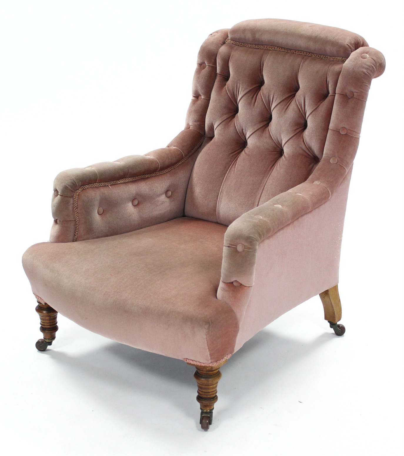 A Victorian armchair, the square buttoned-back, arms, & sprung seat upholstered salmon-pink