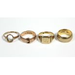 A 9ct. gold wedding band; a ditto signet ring; a ditto belt buckle ring; & a ditto dress ring –