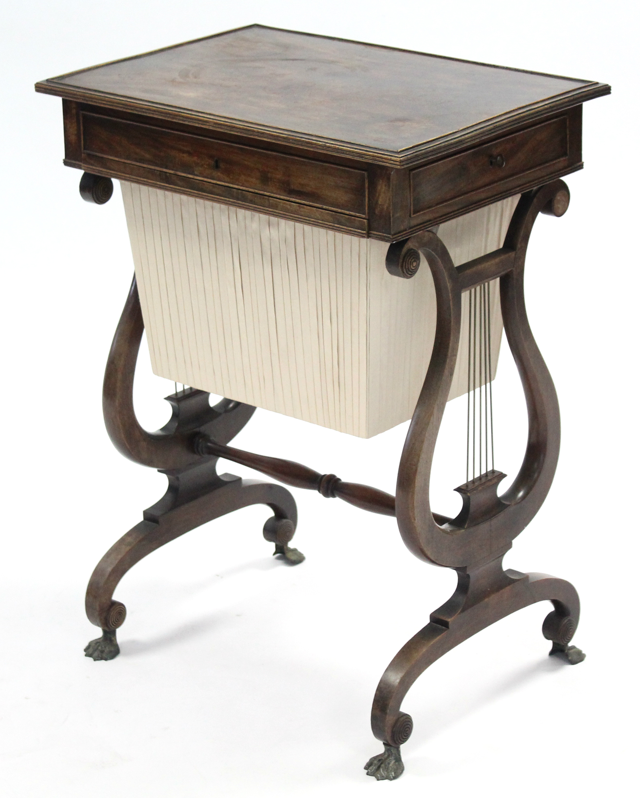 A regency mahogany needlework table, the rectangular top with reeded edge, fitted end drawer &