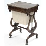 A regency mahogany needlework table, the rectangular top with reeded edge, fitted end drawer &