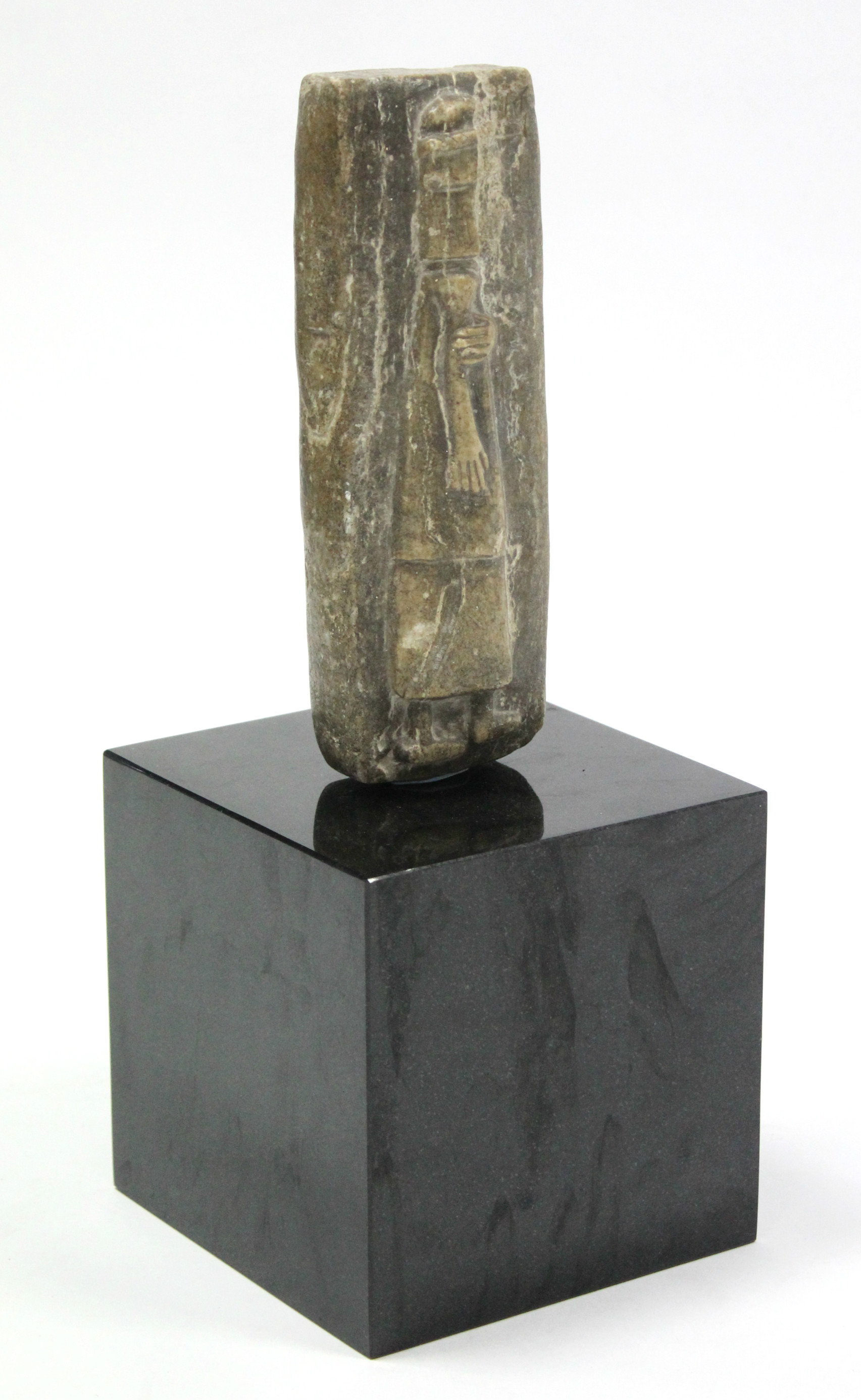 *LOT WITHDRAWN* An Egyptian soapstone carving of rectangular form depicting a male figure