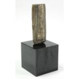 *LOT WITHDRAWN* An Egyptian soapstone carving of rectangular form depicting a male figure