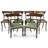 A matched set of six regency mahogany dining chairs, the four single chairs with carved centre