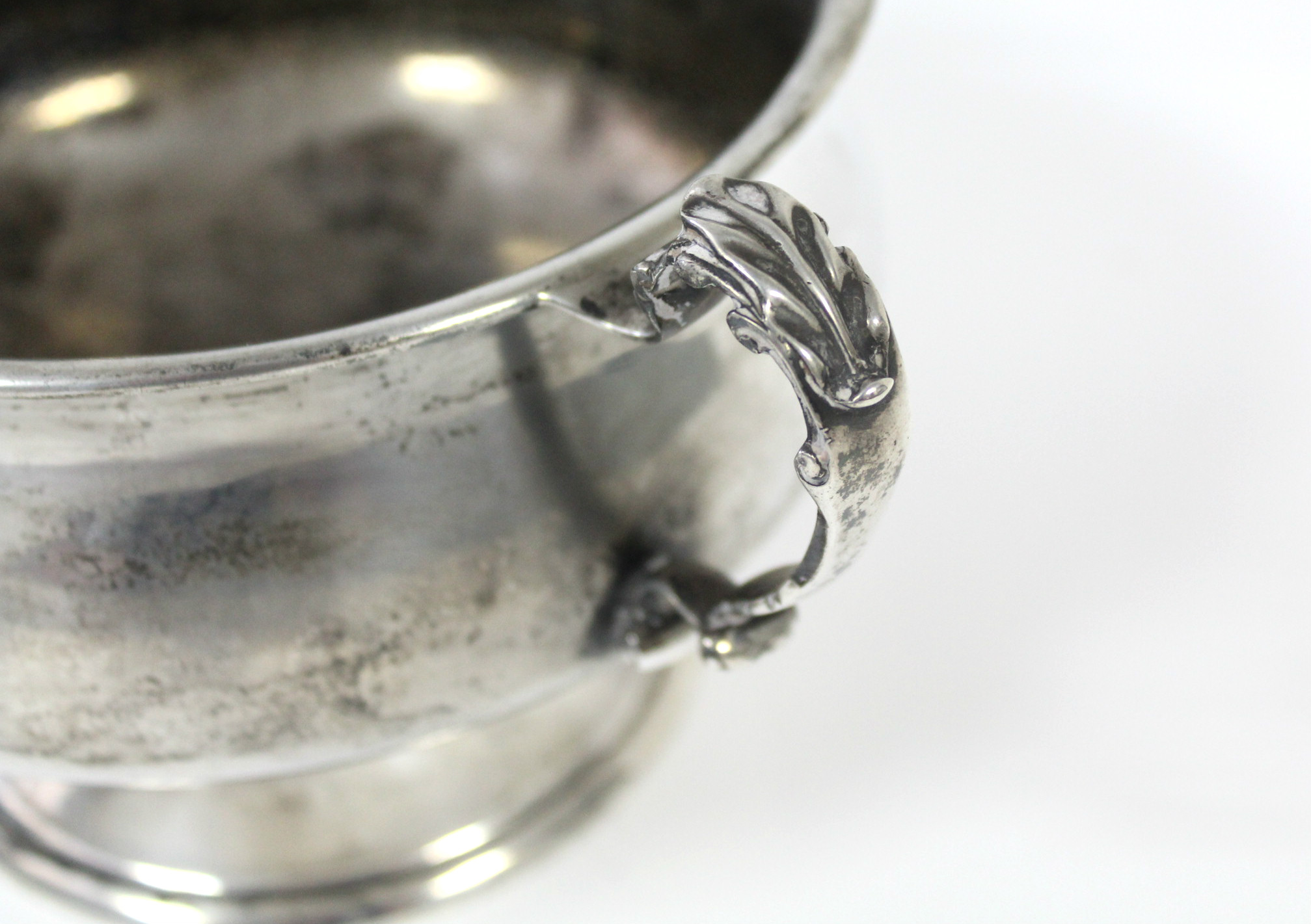 A George V silver two-handled bowl of squat baluster form, with leaf-scroll handles, & on pedestal - Image 3 of 3