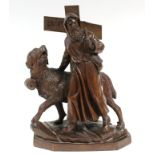 A Black Forest carved wood standing figure of St. Bernard with his dog carrying a barrel attached to