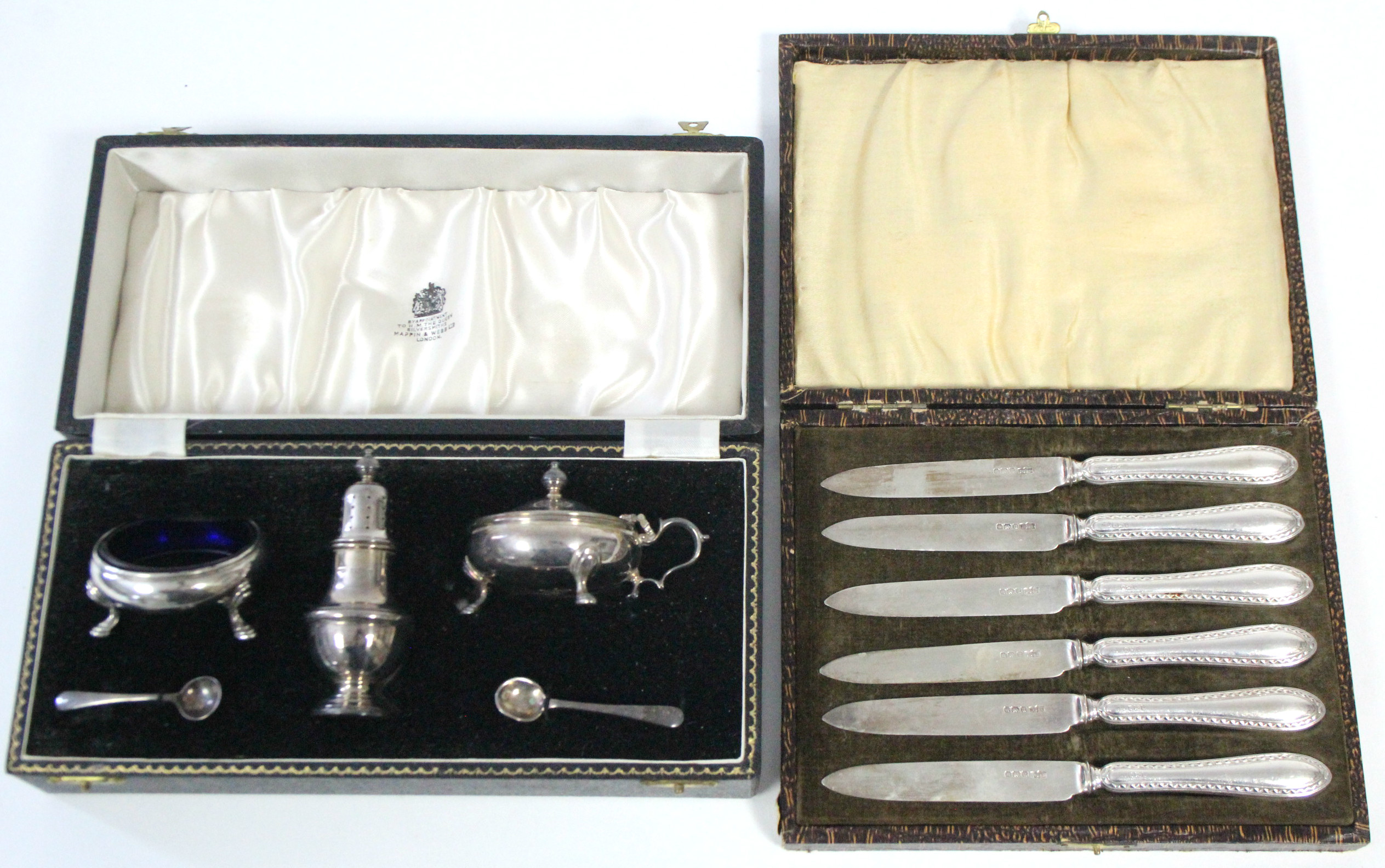 A three-piece silver condiment set comprising: a baluster pepper pot, a mustard pot, & a salt