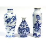 A Chinese porcelain blue-&-white baluster vase decorated with five-clawed dragons amongst clouds,