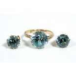 A blue topaz ring set to a Chinese gold shank marked "18ct."; & pair ditto ear studs (un-marked).