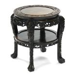 A late 19th century Chinese hardwood circular occasional table, profusely carved all-over with