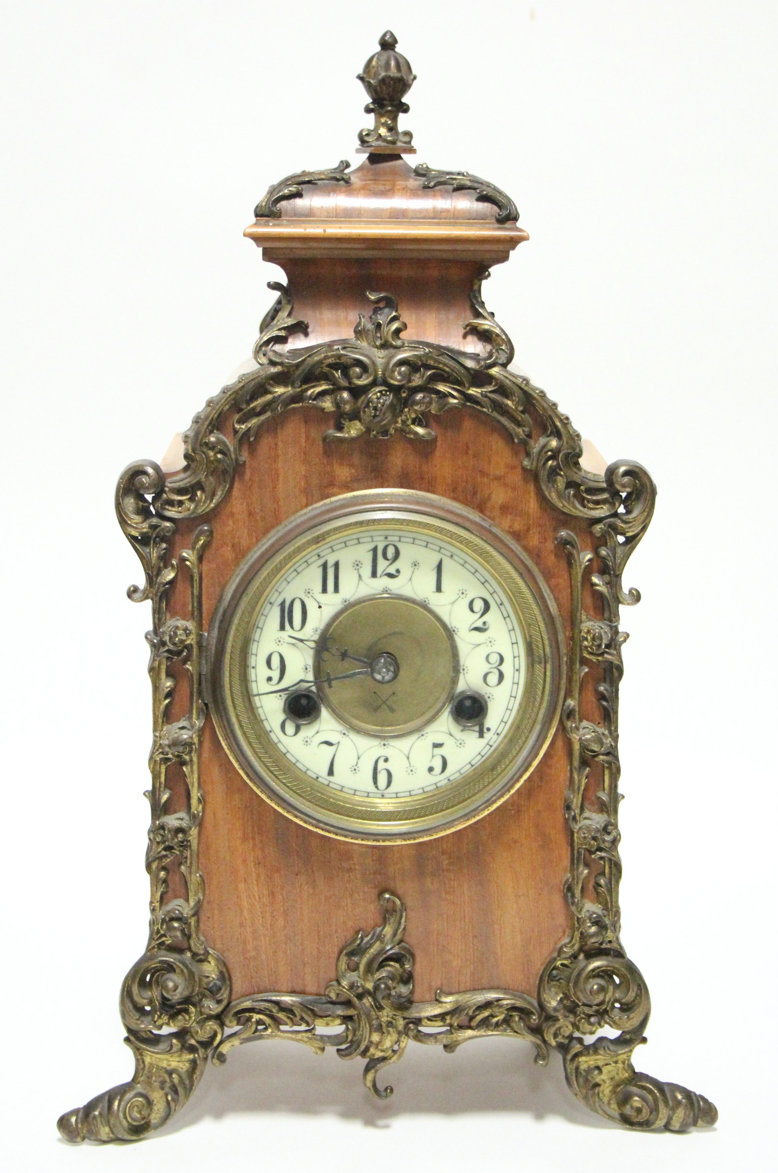 A late 19th century German rococo-style mantel clock, the 4” white enamel dial with Arabic numerals,