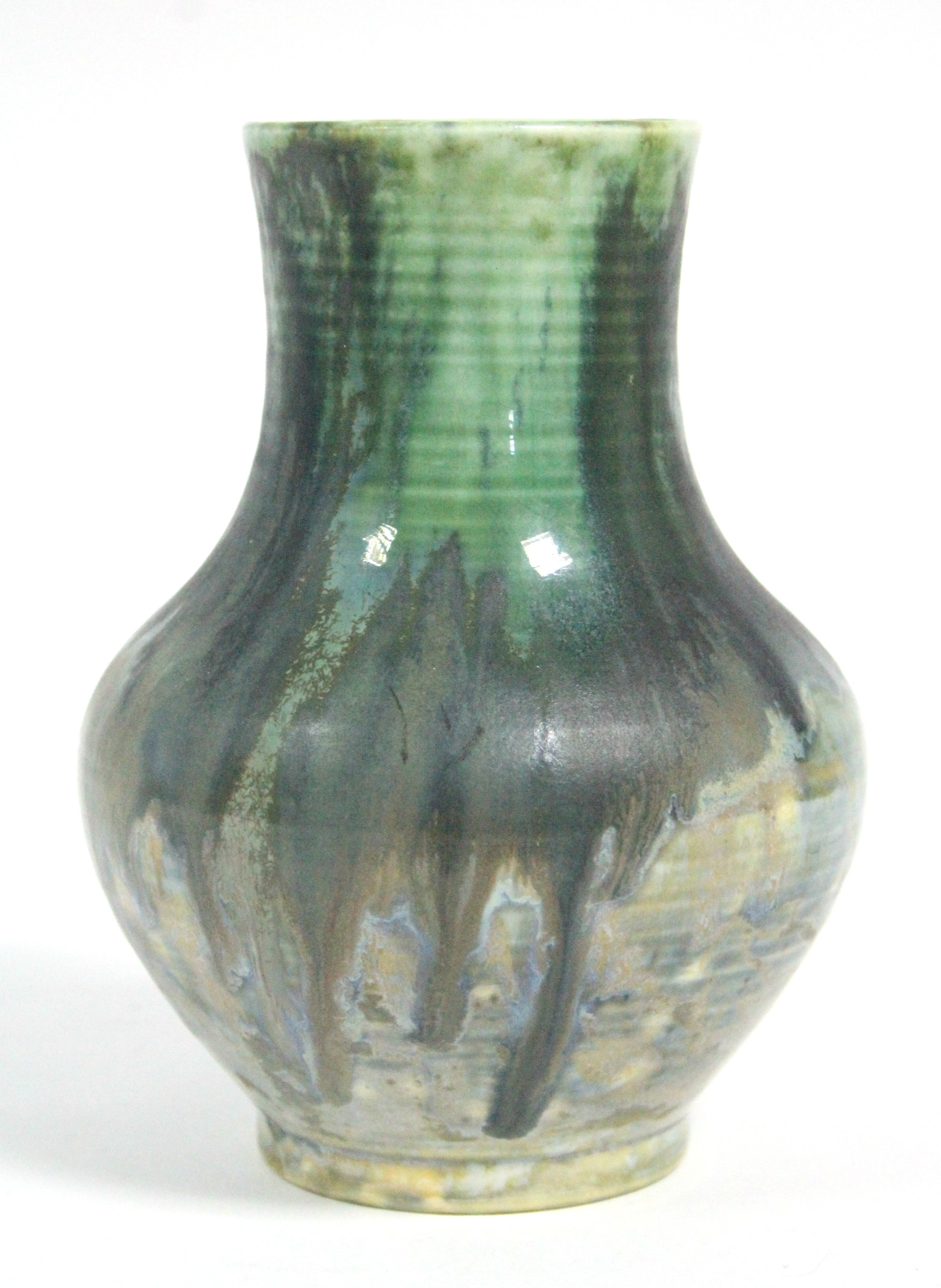 A Moorcroft pottery small baluster-shaped vase with thickly-applied running sea-green glaze,