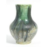 A Moorcroft pottery small baluster-shaped vase with thickly-applied running sea-green glaze,