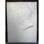A rectangular plaster wall plaque with bas-relief male bust in profile. 20¾” x 15”.