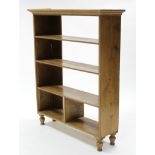 A similar smaller bookcase fitted two adjustable shelves with a two-division compartment below, on