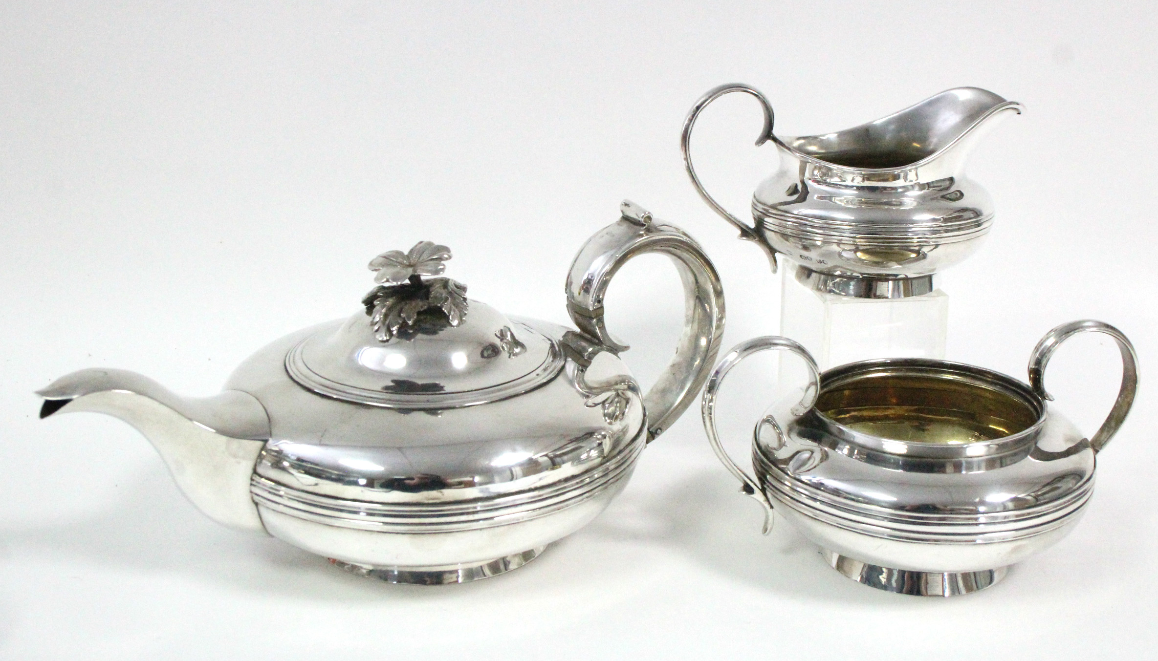 A WILLIAM IV SILVER THREE-PIECE TEA SET, of squat round form with waisted bands & scroll handles,