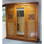 A LATE VICTORIAN CARVED WALNUT COMBINATION WARDROBE with hanging compartment to the left-hand side &