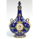 An Italian faience pilgrim flask in the renaissance style, deep blue ground, painted with portraits,