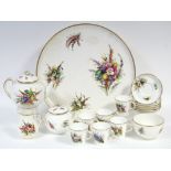 A ROYAL WORCESTER PORCELAIN TEA SERVICE with painted floral decoration on a white ground & with gilt