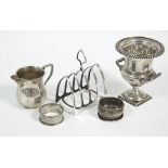 An Edwardian silver two-handled trophy cup with gadrooned rim on pedestal base, 4½" high,