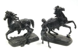 A pair of bronzed speltre Marley horses, 13” high (the figures detached); a green-painted plaster