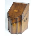 A late 18th century mahogany knife box with sloping hinged lid & serpentine front, brass side