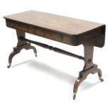 A regency mahogany side table, the rectangular top with rounded corners, reeded edge, & ebony