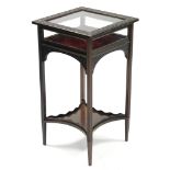 A late 19th century ebonised bijouterie table with blind-fret decoration, on fluted square