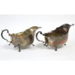 A pair of 18th century style silver oval sauce boats, each with cut-card rim, scroll handle & on