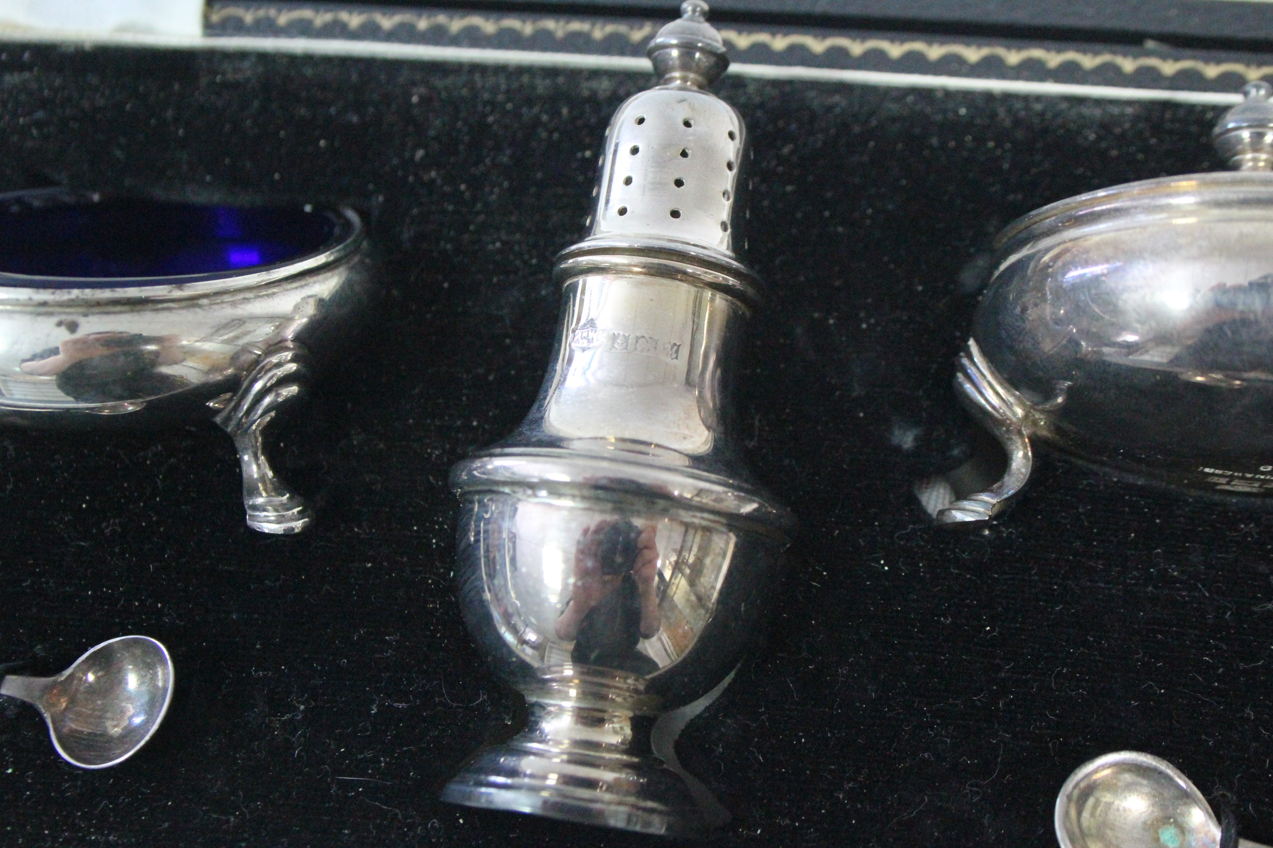 A three-piece silver condiment set comprising: a baluster pepper pot, a mustard pot, & a salt - Image 3 of 4