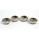 A Set of four Victorian silver salt cellars of sea-urchin design, each on three cast whelk feet, 2¾"
