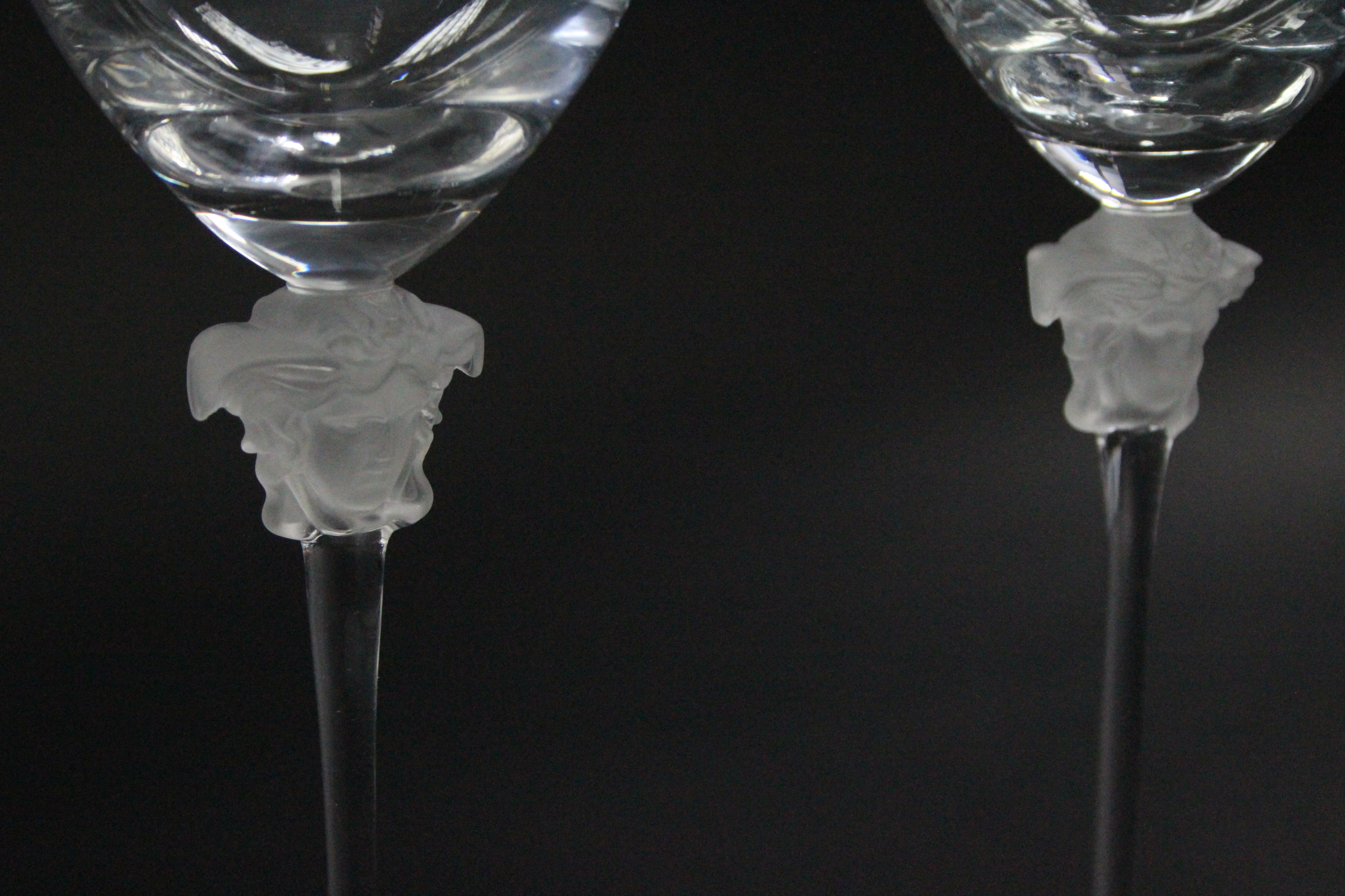 A pair of Rosenthal “Versace” wine glasses, each with opalescent figure-head to the stem; 11¾” - Image 2 of 3
