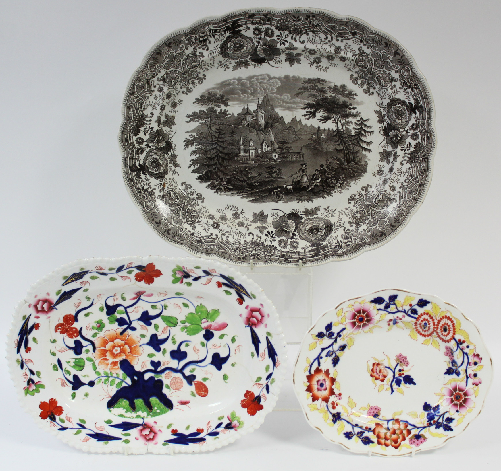 A 19th century W. Ridgeway “Tyrolean” pattern sepia transfer oval meat plate, 17” x 14”; & two