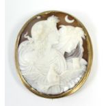 A 19th century oval shell cameo brooch with finely carved scene to two classical female busts