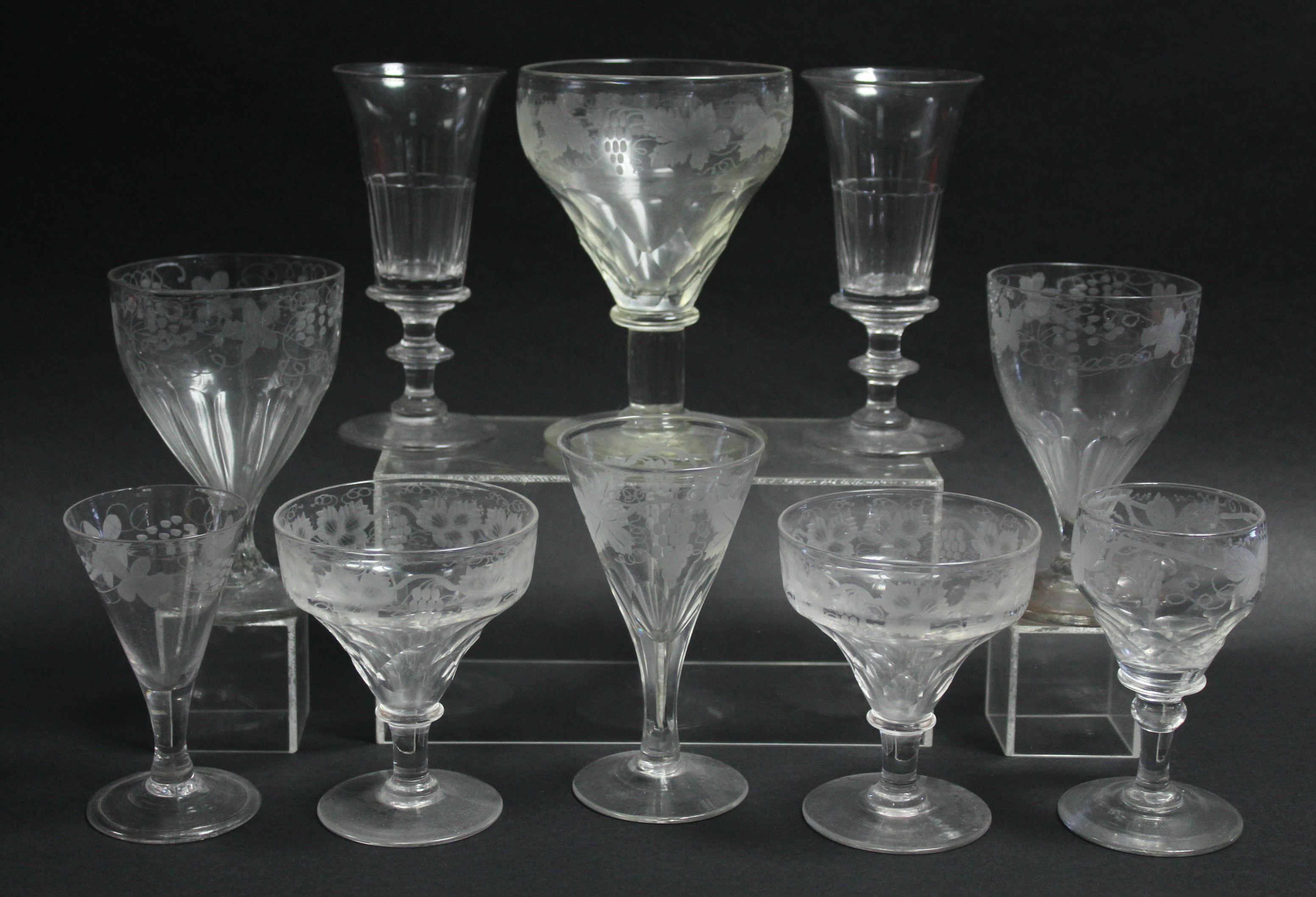 A 19th century cut-glass rummer with engraved grapevine border, 5¾”; a pair of 5” ditto; two odd