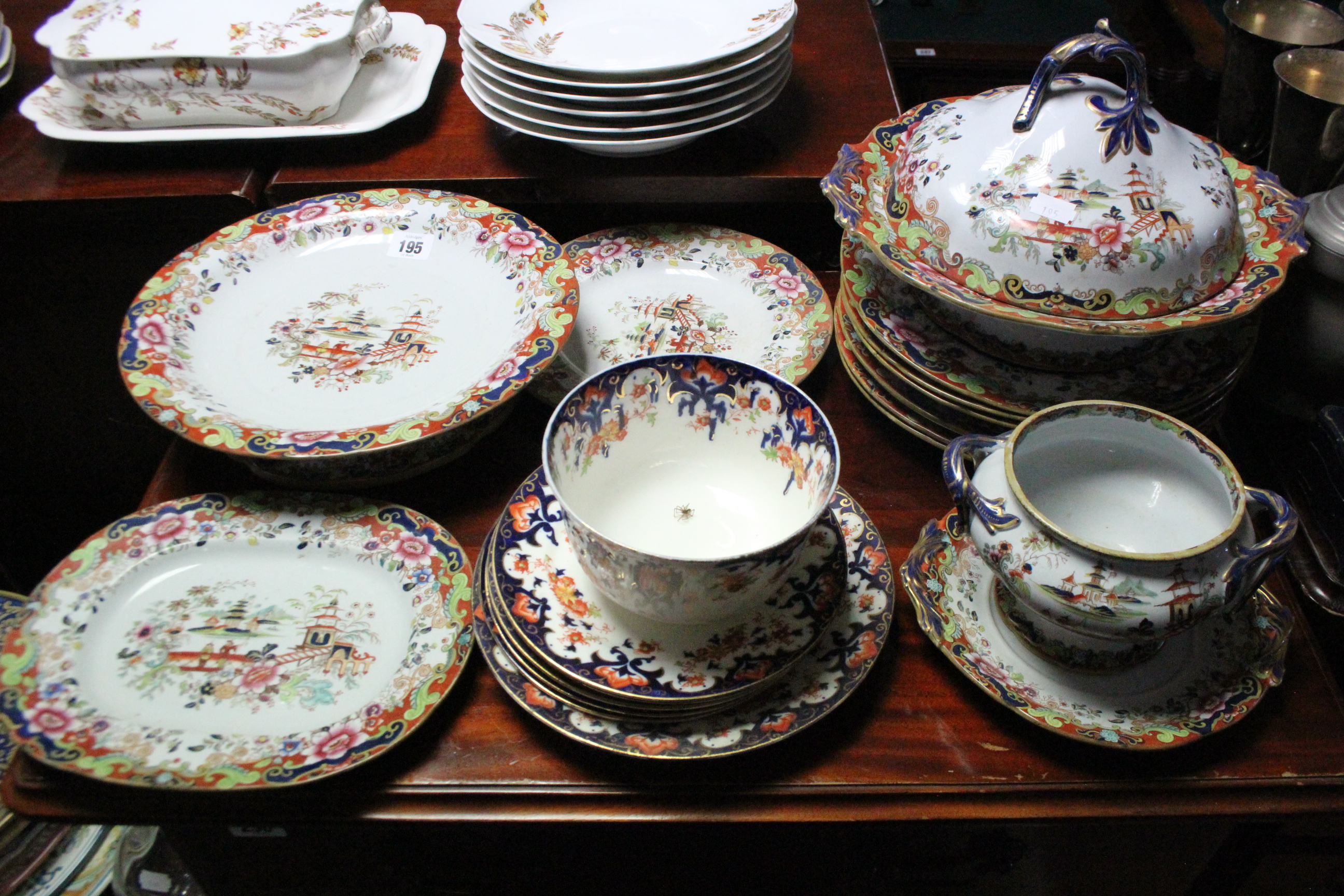 A W & B ironstone china eleven piece part dinner service with oriental garden scene decoration;