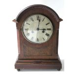 An Edwardian mantel clock with black roman numerals to the 6¼" silvered dial, with chiming