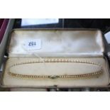 An Omar de Luxe pearl necklace with silver clasp, cased.