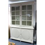 A white painted wood dresser, the upper part fitted three shelves enclosed by pair of glazed