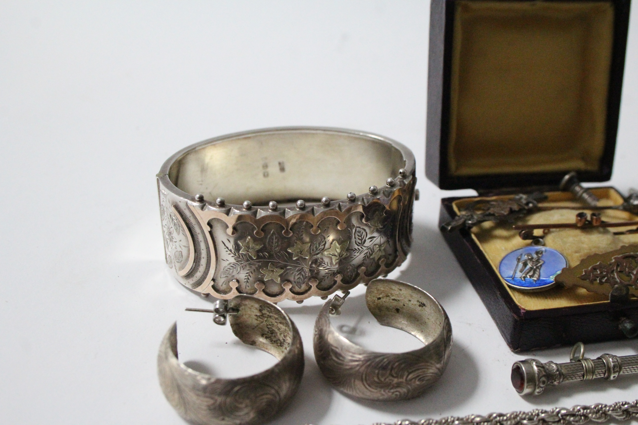 Two 9ct. gold brooches; a gilded silver bracelet; two silver bracelets; a silver hinged - Image 2 of 4