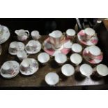 A Royal Stafford bone china thirty-eight piece extensive part tea service of pink & white
